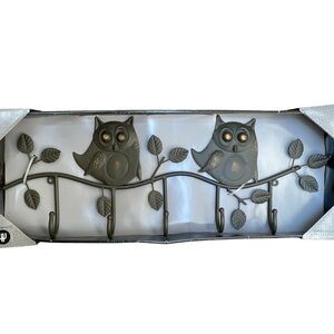 HOMESTRENDS Two Metallic Owls Perched on a branch hanger